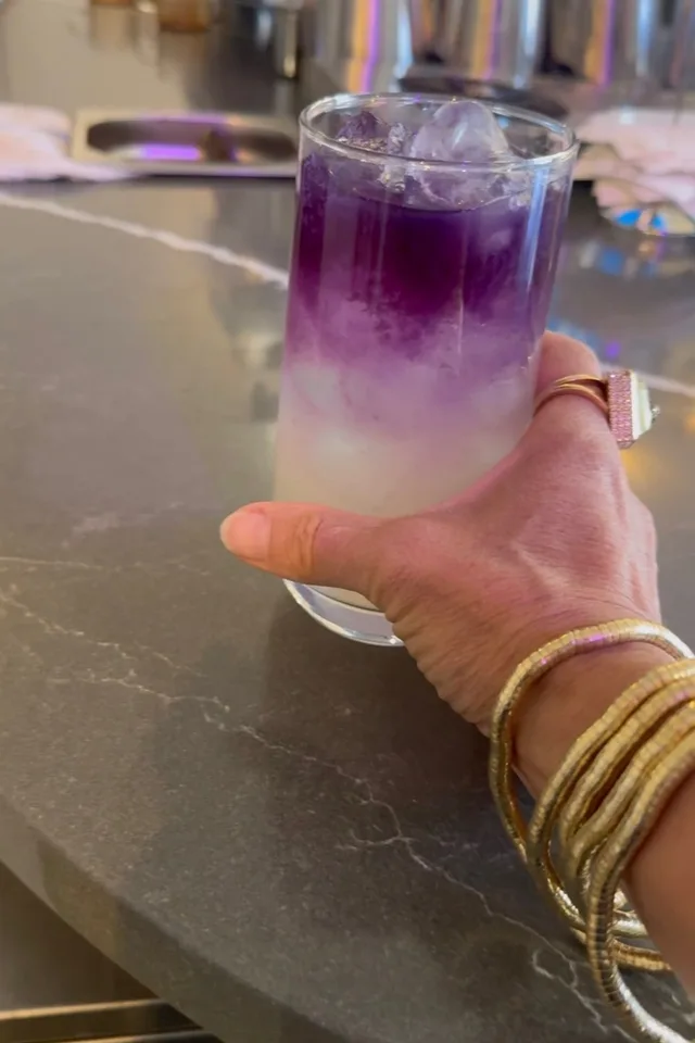 Layered blue and purple matcha lemonade over crystal-clear ice
