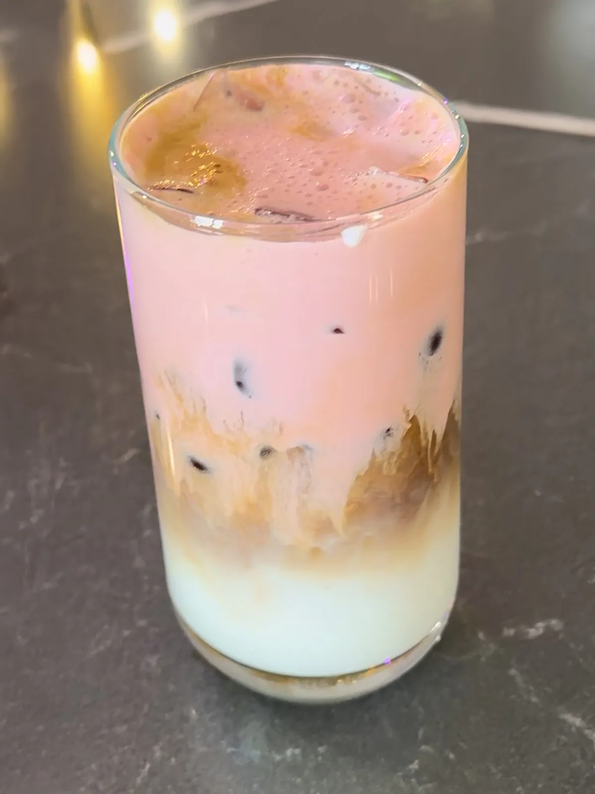 Blush Sky. Milk, espresso, and a strawberry beetroot cream cloud layered together. Antioxidant rich.
