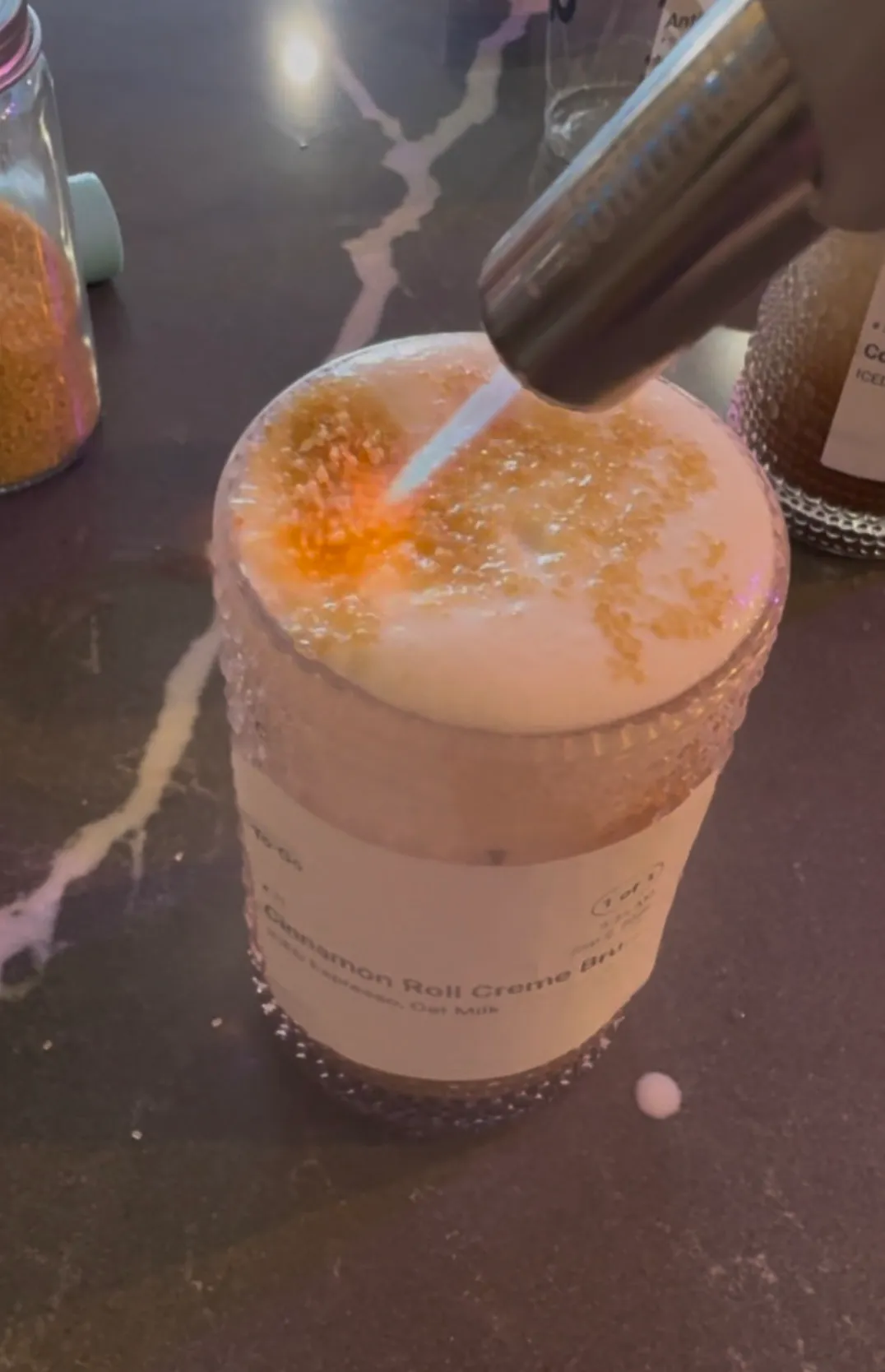 Cinnamon-Roll Crème Brûlée. Matcha or espresso under a cinnamon crème brûlée cream cloud and a brown sugar crust.