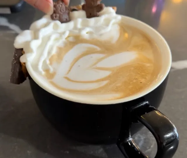 Cookie dough latte with whipped cream and latte art