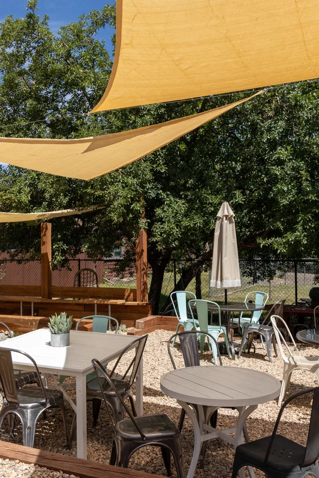 Garden tables under the shade sails