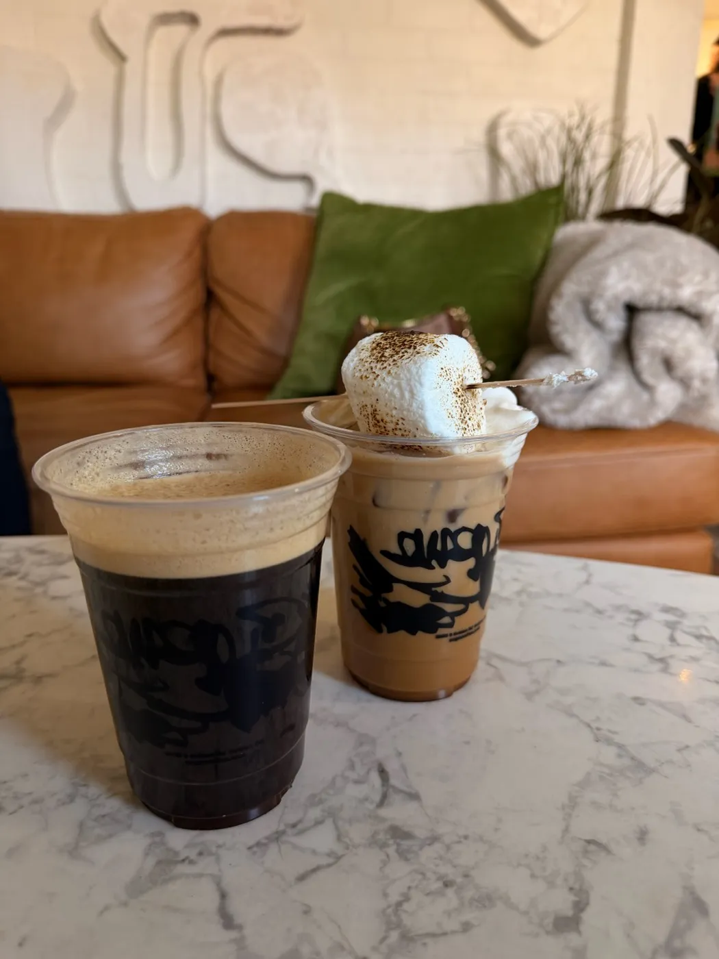 Iced drinks on the couch in the front seating area