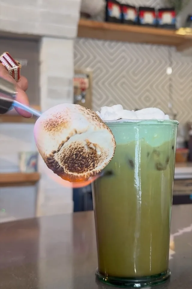 Iced matcha latte with a torched marshmallow