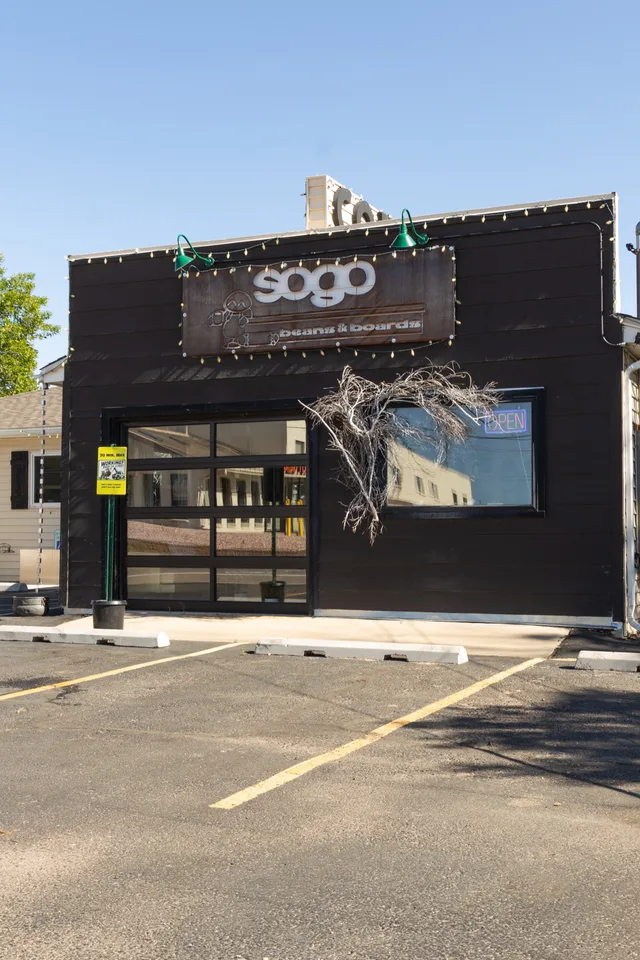 The black storefront from the parking lot on South Golden Road